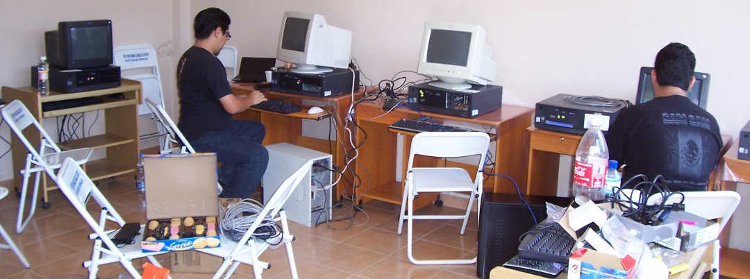 Kids on Computers volunteers and students at work in new KoC computer lab